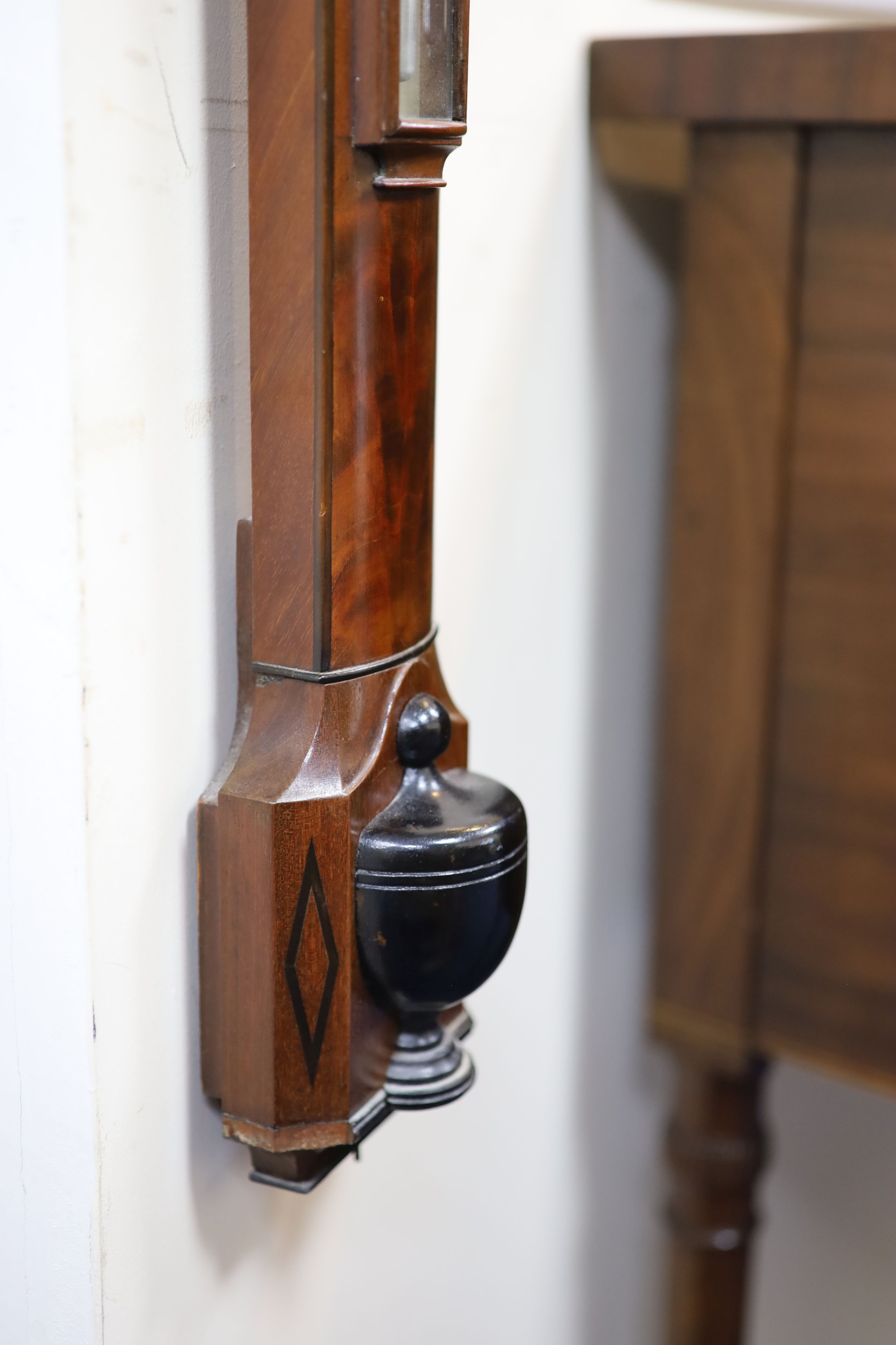 A George III mahogany bow front stick barometer, by D. Cohen & Son, Newcastle upon Tyne H 95cm.
